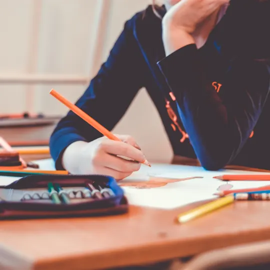 Hands working through financial statements with a calculator